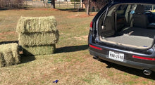 Load image into Gallery viewer, After hauling 4 bales of hay there is no debris when using the Keep It Clean Cargo Liner!